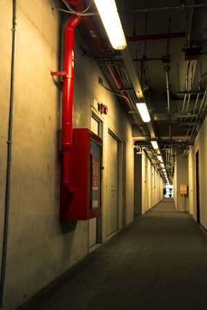 Long corridor interior and fire extinguish equipment, vintage color styleの写真素材