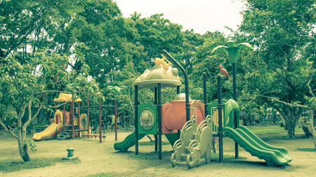 Children's playground at public park, vintage color styleの写真素材