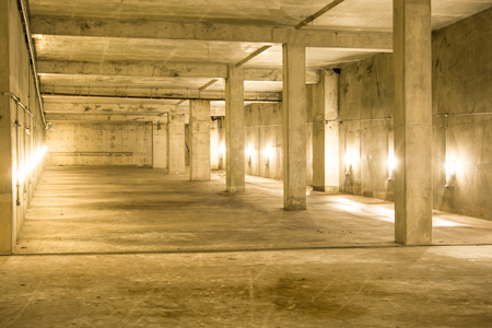Empty industrial garage room interior with concrete floor and wall background, vintage color styleの写真素材