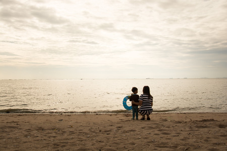 mother and son by on the seaの写真素材