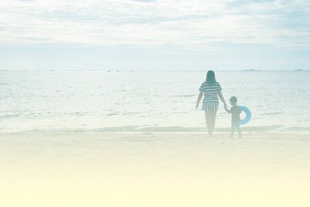 mother and son by on the sea,  color effectの写真素材