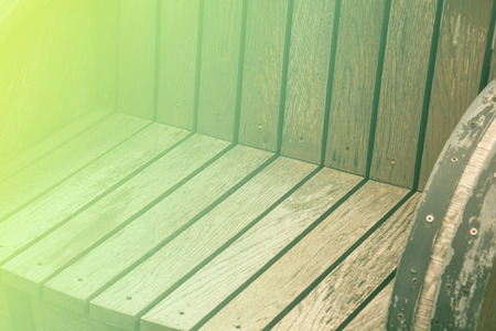 A wooden garden chair seat in a detail, color effectの写真素材
