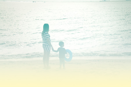 mother and son by on the sea,  color effectの写真素材