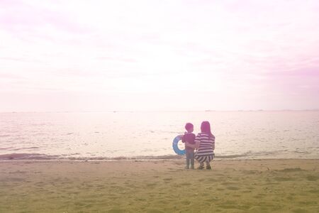 mother and son by on the sea,  color effectの写真素材