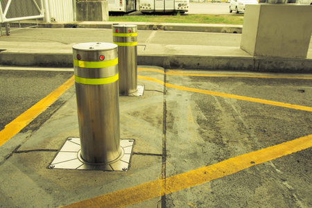 bollards with Security at the gate vintage tone