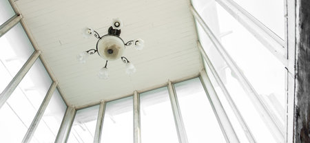 Electronic old vintage lamp hanging on vintage wall and ceiling house
