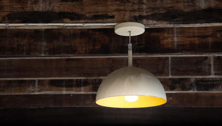 Electronic old vintage lamp hanging on vintage wall and ceiling houseの写真素材