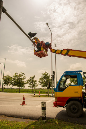people is working on crane for install new traffic lighのeditorial素材