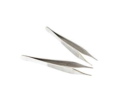 Surgical Instruments (tweezers, pliers, clamp the blade, scalpel, scissors) on a white table.の写真素材