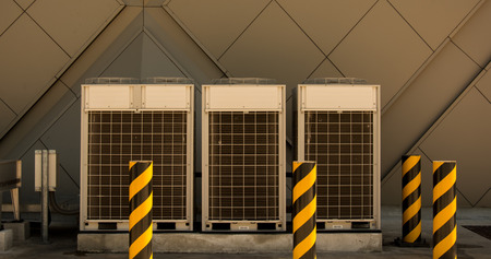 Row of commercial HVAC air conditioner outside condenser cooling and refrigeration conditioning systemの写真素材