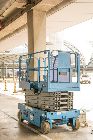 distribution warehouse hall with hydraulic scissors lift platformの写真素材