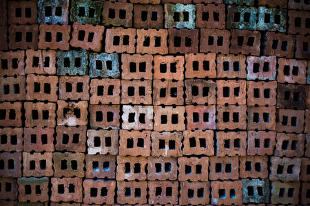 Old brick wall, old texture of red stone blocks closeupの写真素材