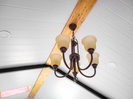 vintage style hanged ceiling lamp warm orange tone light color concrete background wall
