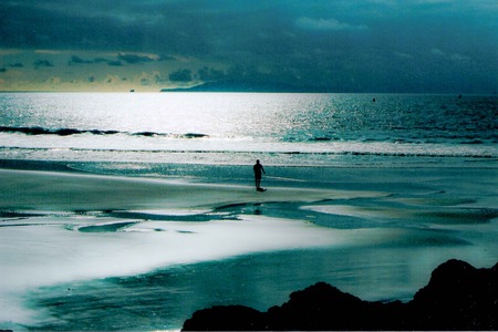Solitude on the beach at sunsetの写真素材