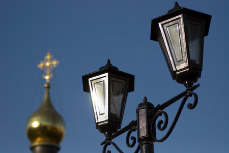 Close up of a street lantern on a background a gold dome of churchの写真素材