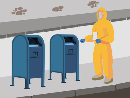 A person in a yellow protective overalls, mask, gloves and shoe covers standing with an envelope in...