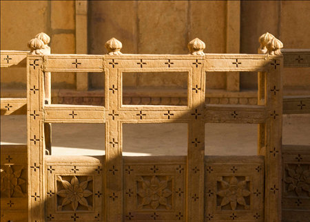 Carved sandstone wall with diagonal shadowの写真素材