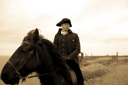 Handsome Male Horse Rider Regency 18th Century Poldark Costume with tin mine ruins and Atlantic...
