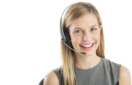 Close-up portrait of confident female customer service representative wearing headset isolated over white backgroundの写真素材