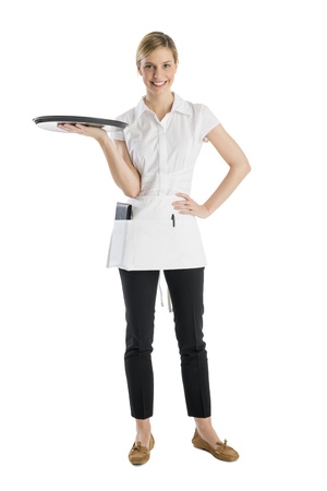 Full length of beautiful waitress with serving tray standing isolated against white backgroundの写真素材