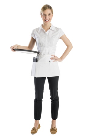 Full length portrait of happy waitress with serving tray standing against white backgroundの写真素材