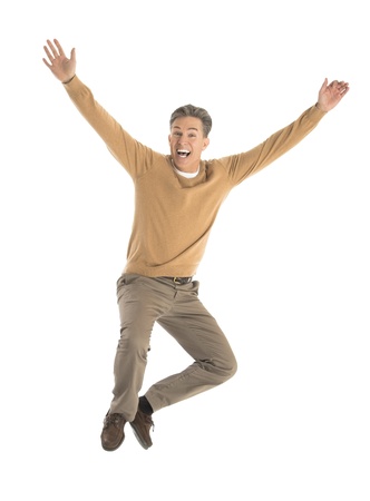 Portrait of cheerful mature man jumping over white backgroundの写真素材