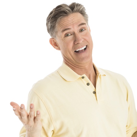 Portrait of happy mature man gesturing while standing over white backgroundの写真素材