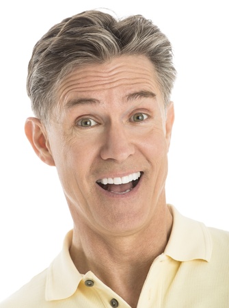 Close-up portrait of cheerful mature man isolated over white backgroundの写真素材