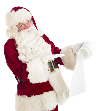 Portrait of Santa Claus gesturing at wish list against white backgroundの写真素材