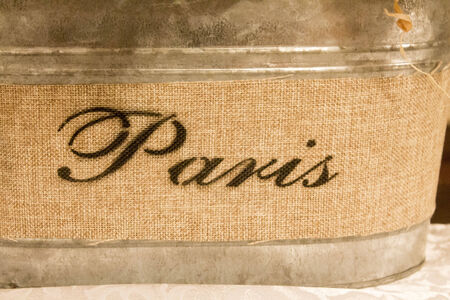 Paris Stenciled on Burlap around a metal containerの写真素材