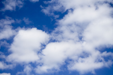 Fluffy Clouds Against a True Blue Skyの写真素材