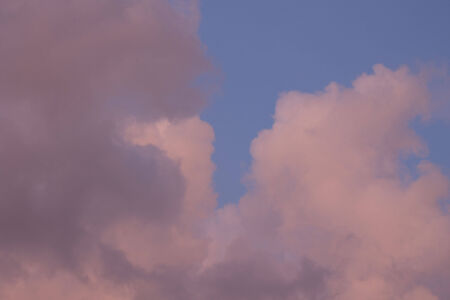 Pink clouds on a Blue skyの写真素材