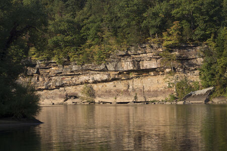 Rocks reflecting in a riverの写真素材