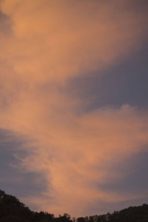 Orange sunset over the mountainsの写真素材