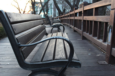 A wooden chair around a trail
