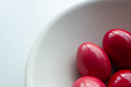 Simple red easter eggs in ceramic bowl