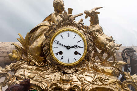 Old vintage clock face with sculpture frameの写真素材