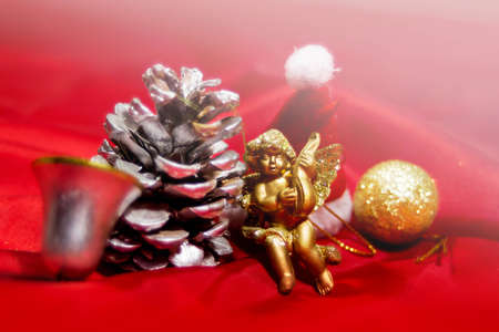 Christmas tree decorations and a toy angel backgroundの写真素材