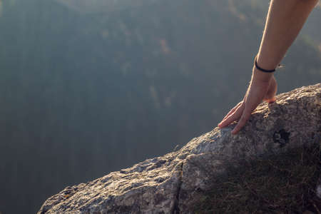 Hand touching the top of a mountain in romaniaの写真素材