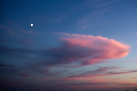 Pink clouds in the vanilla sky sunset and moon heaven