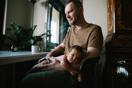 Sweet baby new-born sleeping on father hands