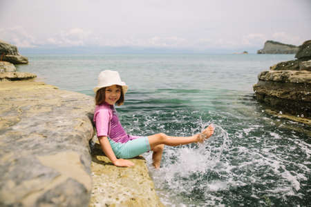 happy little girl on summer vacation Corfu islandの写真素材