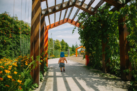 Adorable little 1-2 year old toddler boy having fun on playground in Krakow, Poland