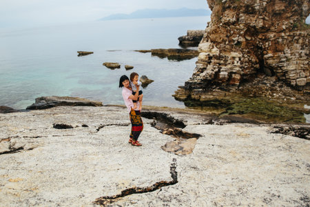 Woman with child on summer vacation Corfu islandの写真素材