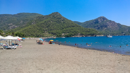 Ekincik Beach, Koycegiz, Mugla / Turkey - July 24 2017: People swimming at the seaのeditorial素材