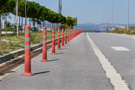Parking barrier for traffic safety. No car parking. Red plastic fencing cones barriers