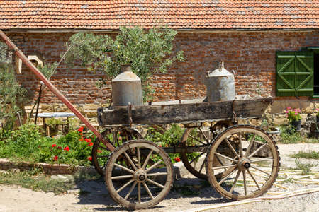 Old milkmaid horse carriage, iron milk kegの写真素材