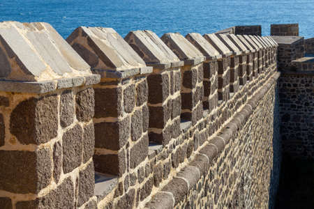 Castle defense wall with seaの写真素材