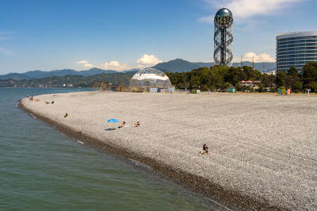 Batumi, Georgia - May 15 2022: People sunbathing on the beach of batumi on a sunny summer dayのeditorial素材