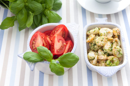 Serving with shrimp and herbsの写真素材